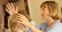 "LAYING ON OF HANDS" BY DAVID MCMILLEN 