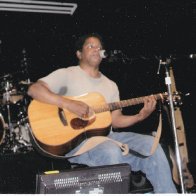 on stage with guitar
