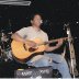 on stage with guitar