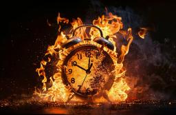 vecteezy_aigeneratedalarmclocksurroundedbyfire_41733743.jpeg