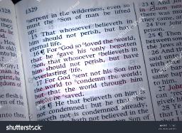 stock-photo-bible-is-opened-to-john-highlighted-by-a-beam-of-light-1915052.jpg