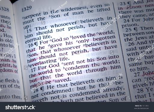 stockphotobibleisopenedtojohnhighlightedbyabeamoflight1915052.jpg