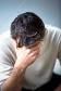 C0342988Depressed_man_holding_his_head_in_his_hands.jpg